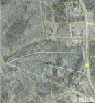 A satellite image showing a mapped area with highlighted boundaries and 0 Hicksboro Road on the right side, Henderson, NC.