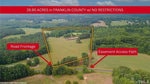 Aerial view of a 28.95-acre property at 0 Opie Frazier Road, Henderson NC in Franklin County highlighted with boundary lines, featuring road frontage and an easement access path