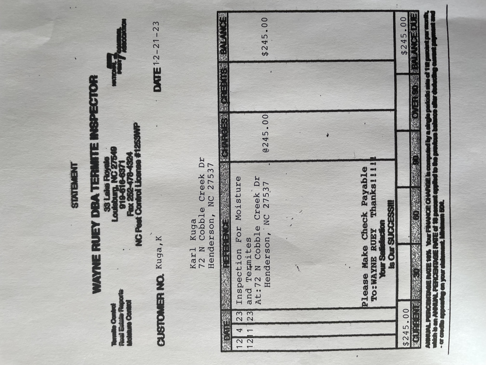 The image shows a tilted view of a printed invoice or bill with various details such as "student," "wayne county inspectors," and monetary amounts indicating the cost of services provided or dues, with a total of $215.00 listed at the bottom of the document.