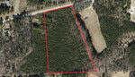Aerial view of a large, forested area outlined in red, near Oxford. The surrounding landscape includes 0000 Winding Oak Road at the top, open fields on the right, and scattered trees and vegetation.