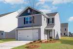 A two-story gray house on 402 Rhino Bend boasts dark shutters and a two-car garage. The front yard features a small lawn and minimal landscaping, highlighted by a young Oxford tree. The sky is clear with a few clouds, and nearby, similar houses are visible.