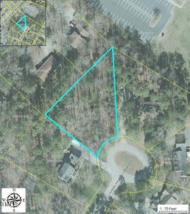 An aerial map view displays a triangular plot of land, Lot 5 Sidney Hill, outlined in blue and labeled "PEND." Nestled in Henderson, the plot is surrounded by wooded areas and houses. An inset map pinpoints its location, with roads and property lines clearly visible.