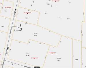 A property map showing numbered land parcels and street names, including Oxford Street and Owens Street. Parcel numbers such as 9375 and 316 Owens Street are visible. Some parcels have dimensions marked in feet, and the map features a sketch of an arrow.