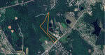 Aerial view of Creedmoor's rural landscape featuring roads, forests, and several ponds. Yellow lines outline an irregular-shaped area labeled "Little Beaverdam Creek." Residential buildings and fields scatter across the scene near 00 Bruce Garner Road.