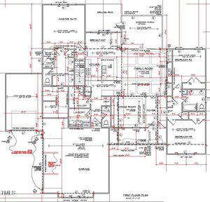 Architectural floor plan of a single-story house showing labeled rooms such as master suite, kitchen, family room, bedrooms, bathrooms, garage, laundry, foyer, and breakfast area, with dimensions and utility details in red.