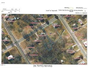 Aerial map of a neighborhood in Granville County, NC, showing property boundaries in yellow and one outlined in blue. Streets and parcel numbers are labeled; houses and trees are visible. The map is oriented sideways.