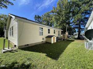 A house with a yard and trees.