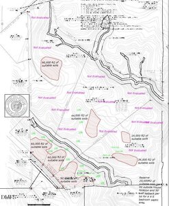 A black-and-white soil survey map showing contour lines, areas labeled "suitable soils," sections marked "Not Evaluated," and various measurement annotations; includes a county seal in the lower left corner.
