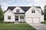 A modern white two-story house with black trim, a dark roof, double front doors, large front-facing windows, and a double garage at 104 Woodland Drive in Oxford. Surrounded by neatly trimmed grass and beautiful landscaping.