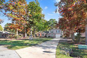 A house with trees around it.
