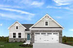 Charming single-story home at 115 Shorebird Lane in Franklinton features beige siding, stone accents, a teal front door, and a three-car white garage. Landscaped shrubs enhance the lawn beneath a partly cloudy sky.