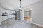 A kitchen with a light fixture.