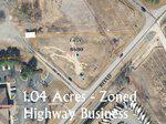 Aerial map view highlighting a 1.04-acre land parcel at 1245 Concord Church Rd, zoned for highway business, located at the intersection of two roads with surrounding parcels marked and labeled.