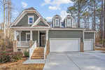 A house with a garage and a driveway.
