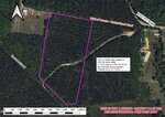 Aerial view of a wooded land parcel outlined in purple, with nearby roads, undeveloped access, and a label noting 13.7 acres. The map is marked for representational purposes only.