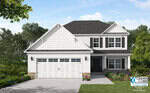 A modern two-story white house with black shutters, a gray shingled roof, and a double garage. The yard features green grass, bushes, and trees. The Caviness & Cates Communities logo is visible in the bottom right corner.