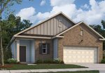 A single-story house with a brick and siding exterior, a two-car garage, a gable roof, and minimal landscaping in the front yard under a partly cloudy sky.