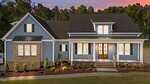 A modern two-story house with blue-gray siding, white trim, a dark shingled roof, and a brick accent. Warmly lit windows and a wooden front door face a landscaped yard at sunset.