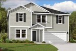 Two-story suburban house with light gray siding, white trim, and black shutters. The home has a covered front entry, multiple windows, a two-car garage, and a concrete driveway. Trees and lawn are visible in the yard.