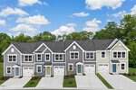 A row of modern two-story townhouses with attached garages, gray and beige exterior siding, small front yards, and a driveway in front of each unit, with trees and a blue sky in the background.