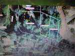 Aerial map view showing several wooded property plots outlined in white and blue with labeled parcel numbers (e.g., 0095 01034, 0095 01035, 0095 01002, 0095 01003) and yellow dashed boundary lines.