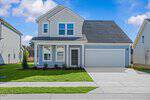A two-story modern suburban house at 117 Millview Way in Franklinton features light blue siding, white trim, a dark front door, double garage, and a neatly manicured lawn under a partly cloudy sky.