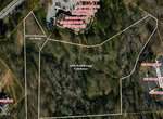 Aerial map view showing outlined property boundaries for 1320 Oxford Loop (7.22 acres) and 1312 Oxford Loop (1.52 acres), with surrounding roads, wooded areas, and nearby labeled properties for both 1320 and 1312.