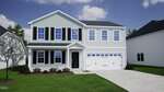 Located at 68 Mistflower Drive in Youngsville, this two-story suburban house features light gray siding, black shutters, a two-car garage, small front porch, manicured lawn with shrubs and a tree, plus a driveway under a clear sky.