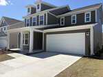 A modern two-story house at 250 Sugar Pine Drive in Franklinton, featuring gray siding, white trim, a large white double garage door, a covered front porch, multiple front-facing windows, and a neatly maintained lawn and driveway.