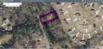 Aerial map of Granville County GIS showing a residential area with property boundaries. The search for "Dove" highlights Lot 16 Dove Road in purple near Oxford, surrounded by trees and neighboring homes.