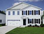A two-story white house with black shutters at 355 Buckthorn Drive, Youngsville, features a double garage, a small front porch, and neatly trimmed bushes along the front under a partly cloudy sky.