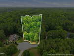 Aerial view of a wooded property at 160 Siltstone Drive in Franklinton, outlined in white at the end of a cul-de-sac, surrounded by dense green trees with a large house nearby on the left.