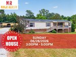 A beige manufactured home with a porch and carport sits on a grassy lot at 546 Duke Drive, Rougemont. Text overlay reads: "Open House Sunday 06/28/2026 3:00PM - 5:00PM." The Ninja Realty logo is in the top left corner.