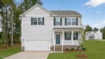Two-story white house with blue shutters, a front porch, double garage, and a concrete driveway situated at 50 Rolling Hills Drive in Youngsville. The yard is grassy with a few young trees, and the home sits in a suburban neighborhood with other houses visible in the background.