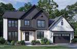 Modern two-story house with black and white exterior, large windows, two prominent black gables, covered entry, and an attached two-car garage. Situated at 104 Spring Grove Drive in Oxford, the yard features green grass, bushes, and trees in the background.