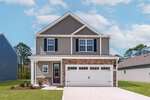 Located at 35 Saddle Way in Youngsville, this two-story suburban house features beige siding, stone accents, and a white double garage door. The front yard has minimal landscaping and a concrete driveway. The sky is partly cloudy, with other houses visible nearby.