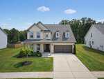 Two-story suburban house with light-colored siding, dark roof, and attached two-car garage located at 90 Glendavis Hollow Drive in Franklinton. Concrete driveway leads to the garage. Well-kept lawn and small landscaping in the front yard. Neighboring homes visible on both sides.
