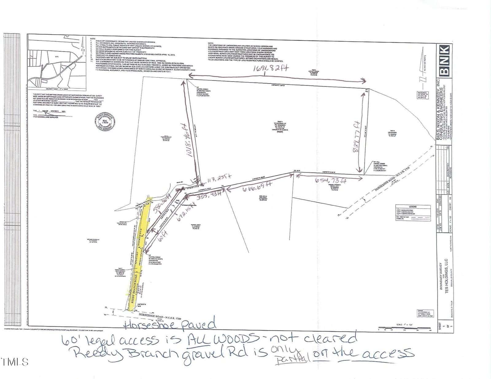 Black and white survey map showing a plot of land with labeled boundary lines and measurements. The map includes notes about access points, wooded areas, and a gravel road. Handwritten annotations highlight specific features in yellow and text.
