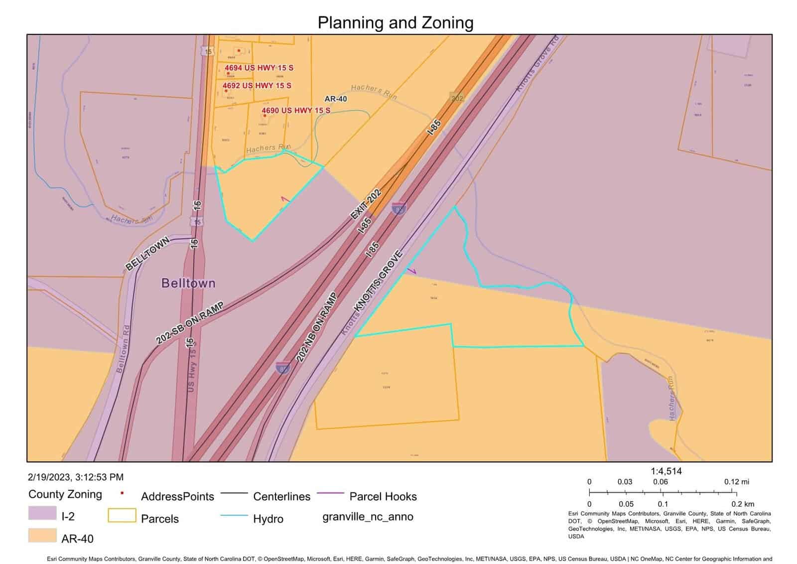 A map titled "Planning and Zoning" shows parcels colored in different zones: I-2 in purple, AR-40 in yellow. Highways and ramps are marked in red. Address points and parcel hooks are indicated. Date is 2/19/2023, 3:12:53 PM. Scale and legend are included.
