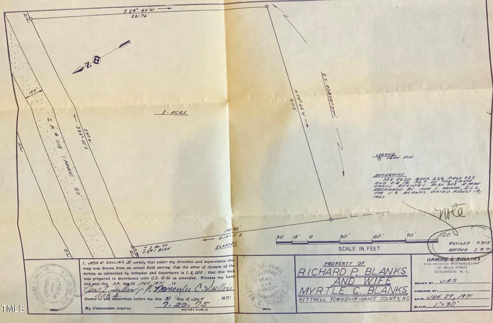 This image features a folded property deed with various handwritten notes, signatures, and a blue stamp indicating the owners' names, "richard p. blanks and myrtle e. blanks.