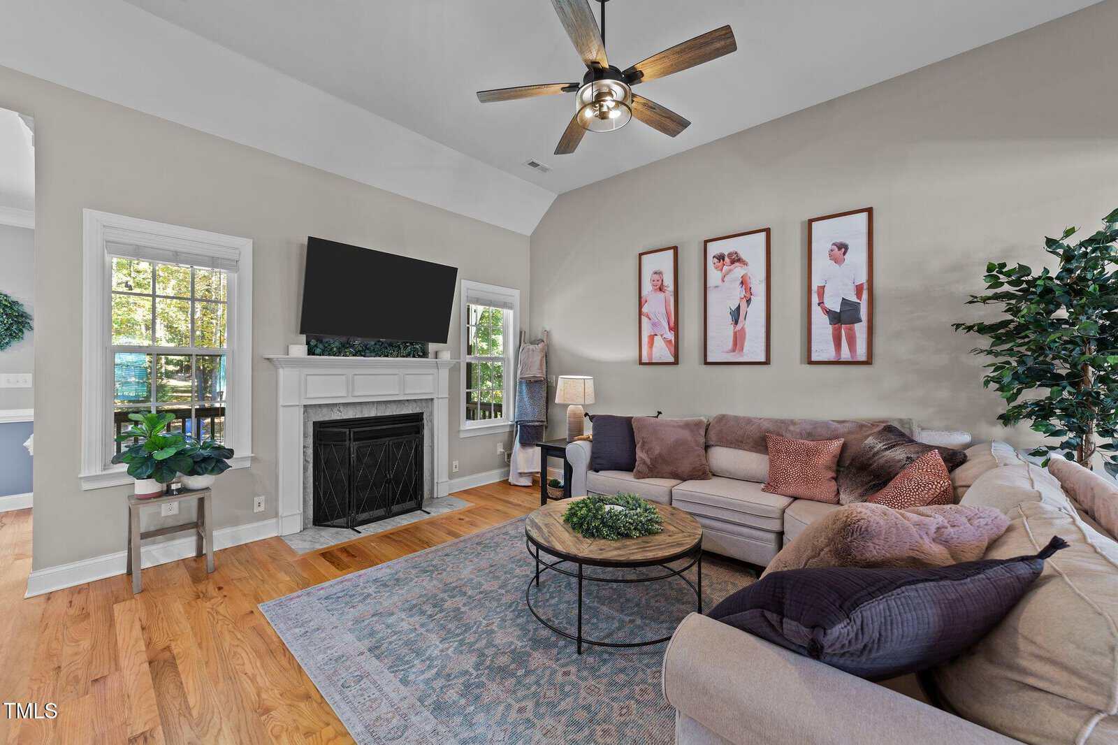 A living room with a fireplace and a couch.
