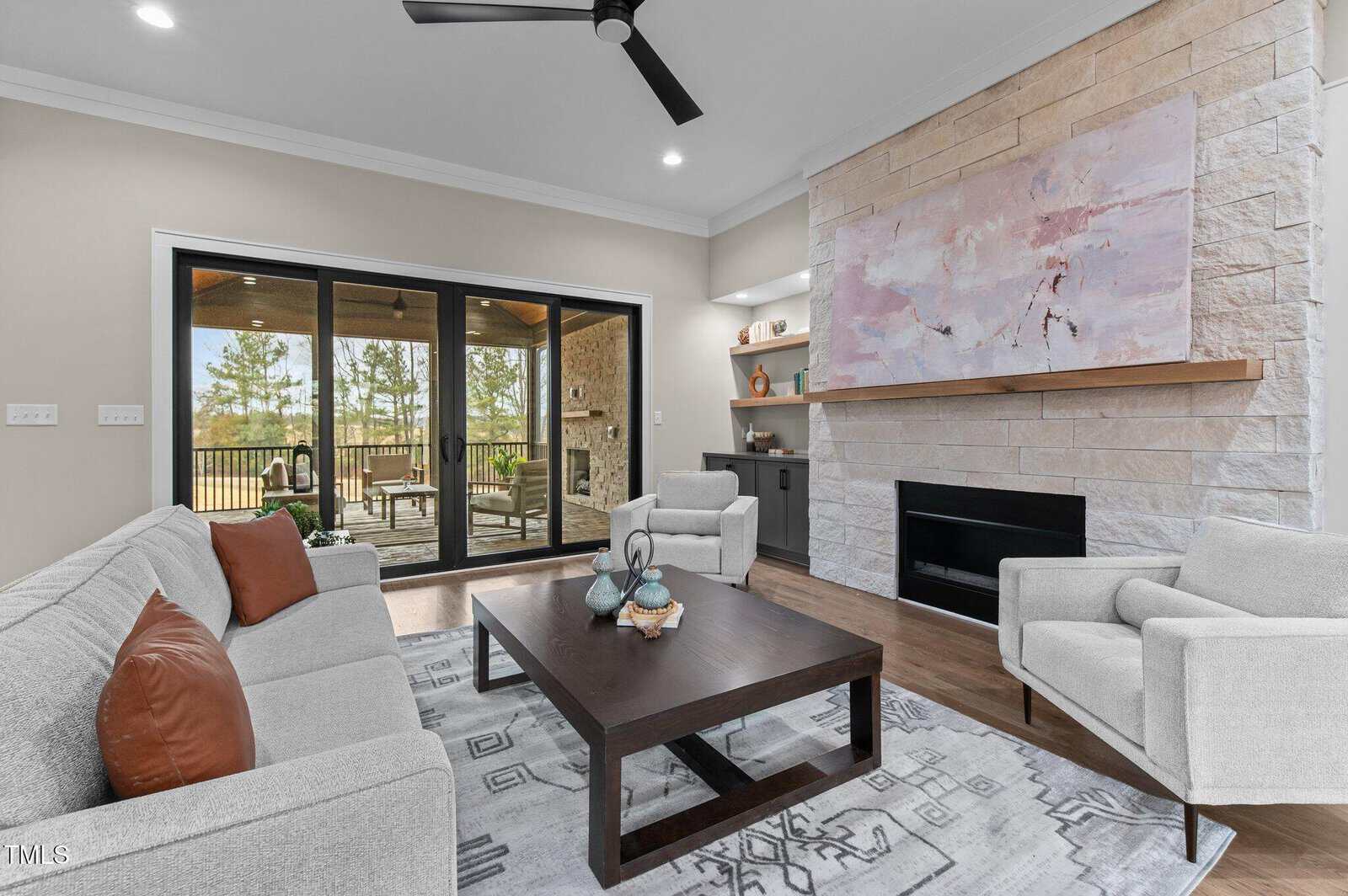 A living room with a fireplace and a couch.