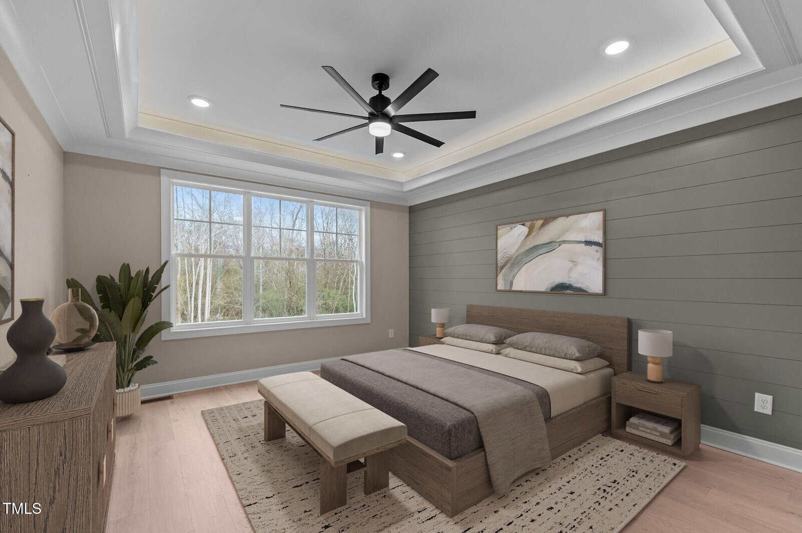 Modern bedroom with large window, green accent wall, wooden bed, beige bedding, two nightstands, a bench, ceiling fan, dresser with decor, potted plant, and abstract art above the bed. Light wood floor and recessed ceiling lighting.