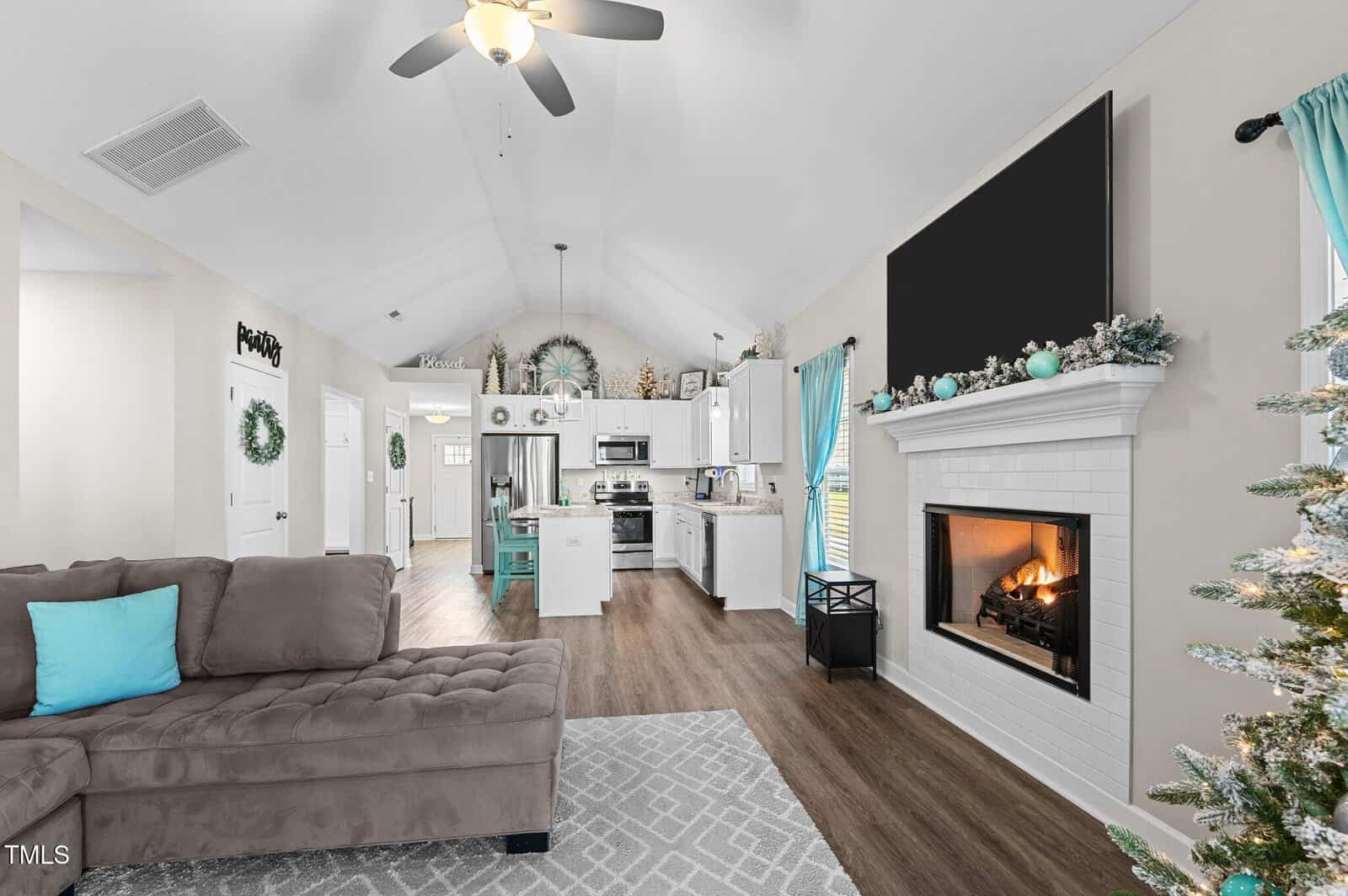 A living room with a fireplace and a couch.