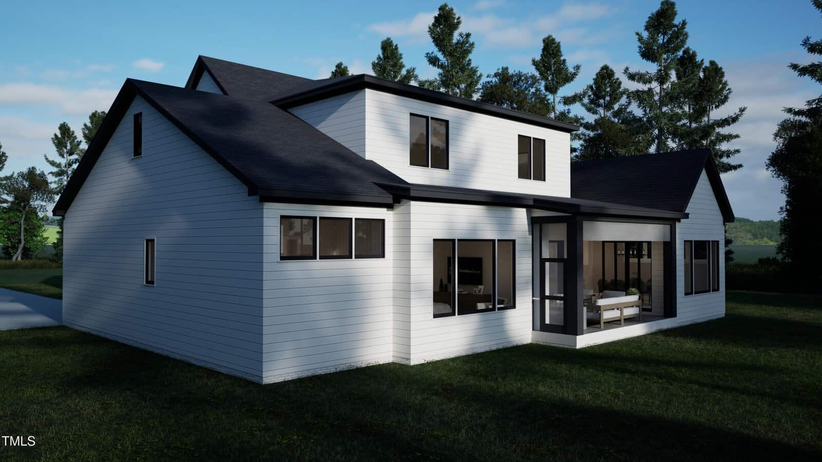 A modern two-story white house with black trim and large windows, surrounded by grass and trees under a partly cloudy sky. The back patio has outdoor seating enclosed with glass walls.
