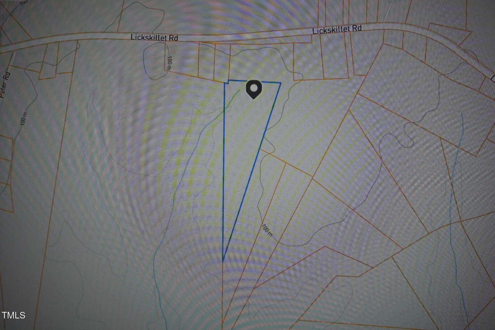 A map shows a triangular plot of land marked with a pin, located off Lickskillet Rd. The area is outlined in blue, with surrounding property lines and roads visible.