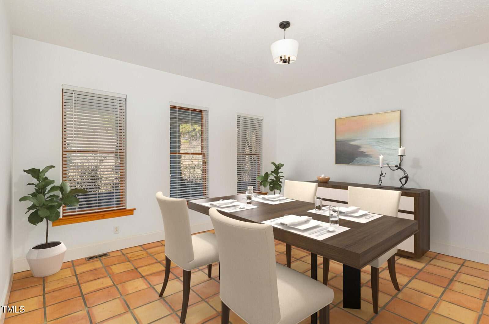 A dining room with a dark wood table, six white chairs, a potted plant, large windows with blinds, a sideboard with decor, and a landscape painting on a white wall. The floor has terracotta tiles.