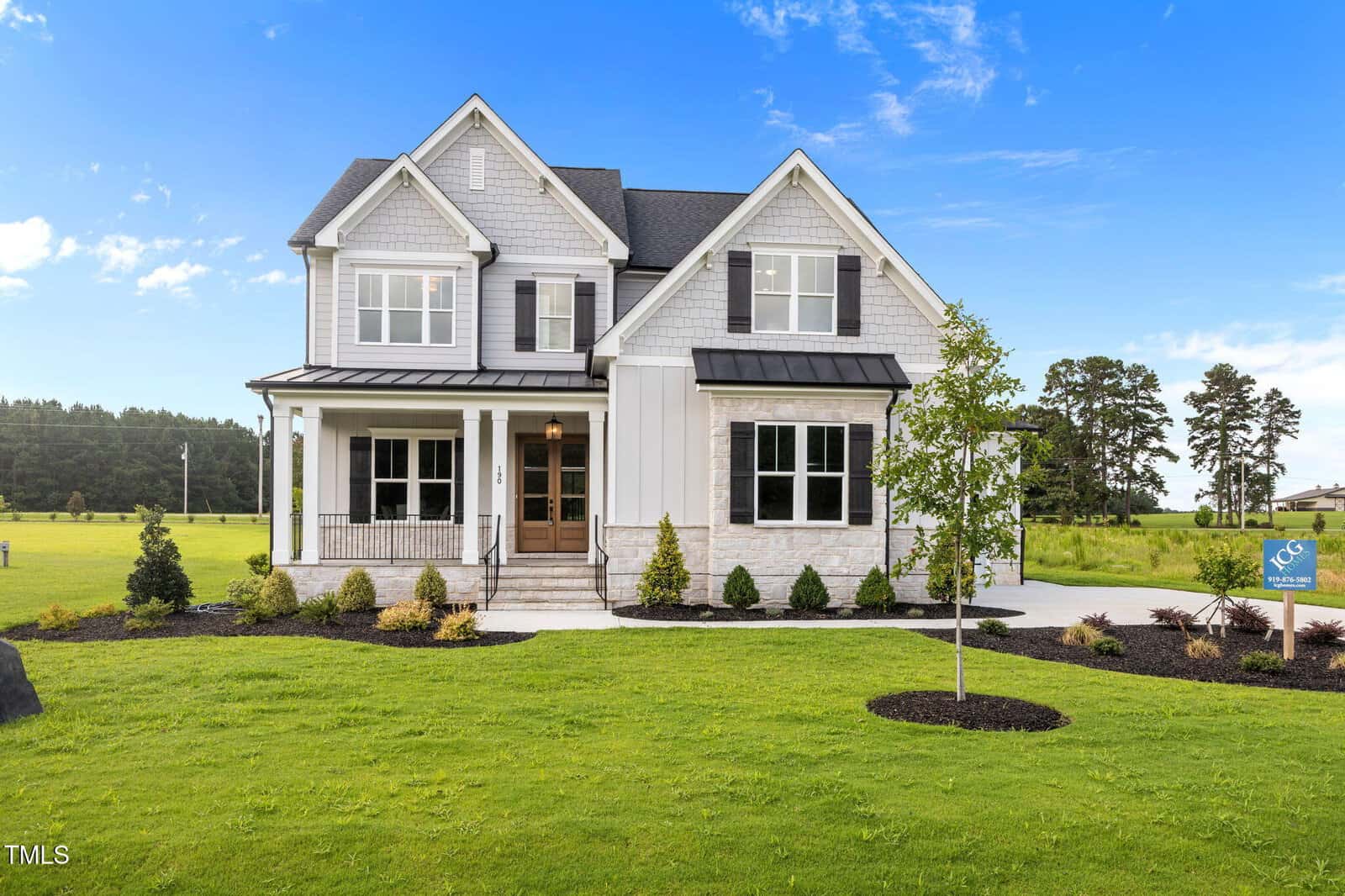 A house with a lawn and trees.