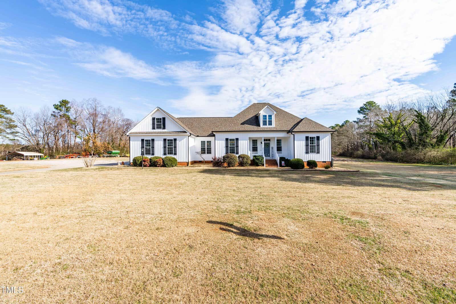 A house with a large lawn.