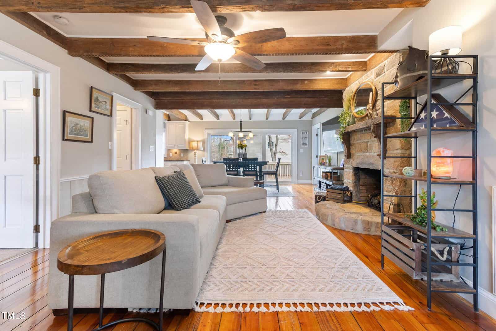 A living room with a couch and a fireplace.